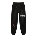 Black pants with text and a red star on a white background